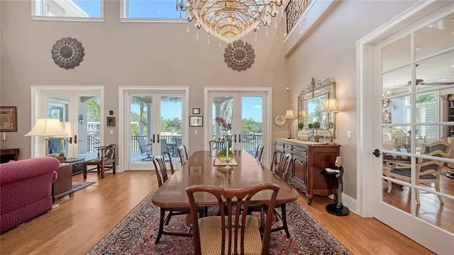 a living room with furniture a rug and a chandelier