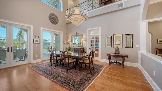 a living room with furniture a flat screen tv and a table