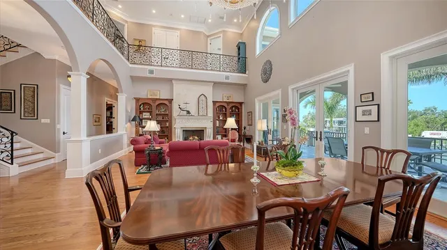a living room with furniture a rug and a large window