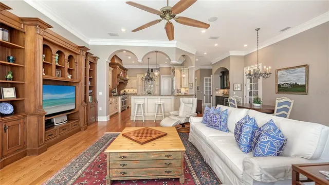 a view of a dining hall with lots of furniture and chandelier