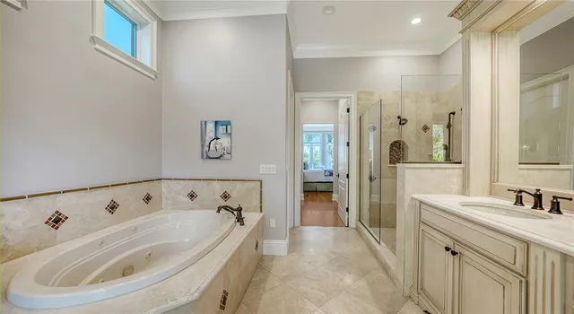 a kitchen with stainless steel appliances granite countertop a refrigerator sink and cabinets