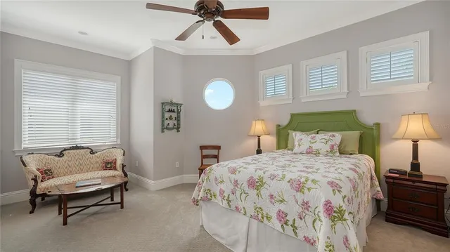 a view of a chairs and table in patio with swimming pool