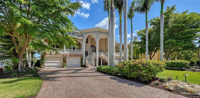 a living room with furniture fireplace and a large window