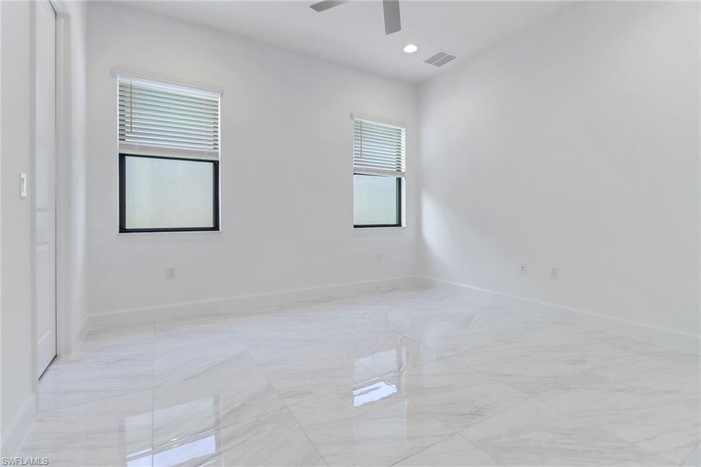 20458 Fair Oak Lane Estero, FL 33928 - Photo 12 of 40 Empty room featuring ceiling fan