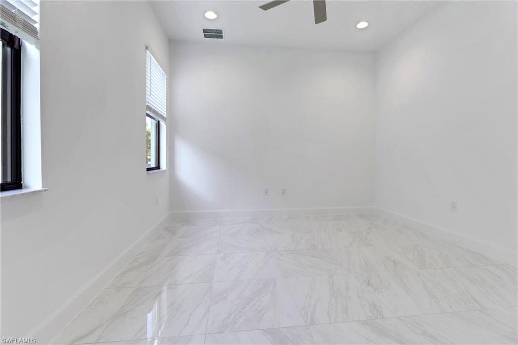 20458 Fair Oak Lane Estero, FL 33928 - Photo 13 of 40 Spare room featuring ceiling fan