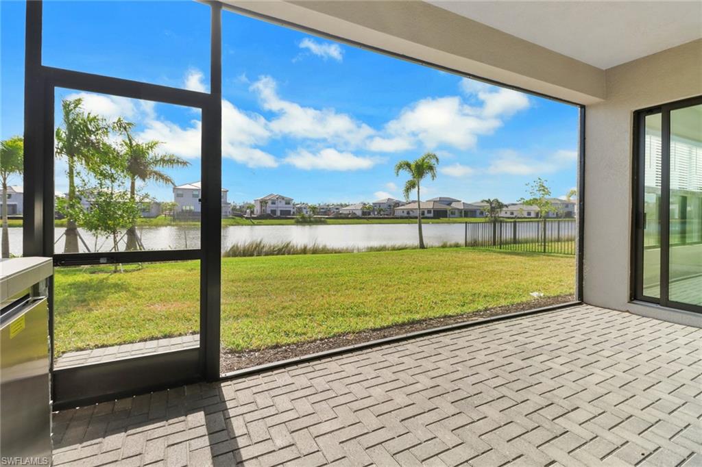 20458 Fair Oak Lane Estero, FL 33928 - Photo 34 of 40 Unfurnished sunroom with a water view