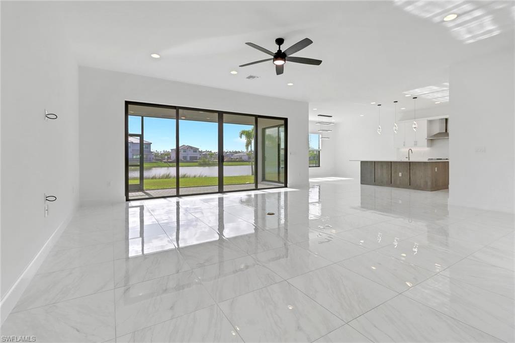20458 Fair Oak Lane Estero, FL 33928 - Photo 6 of 40 Unfurnished room featuring ceiling fan