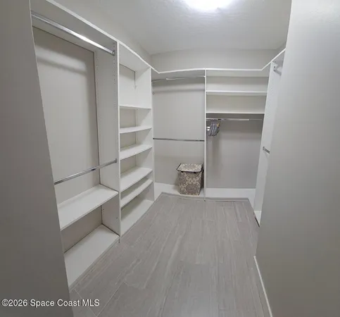a view of an empty walk in closet