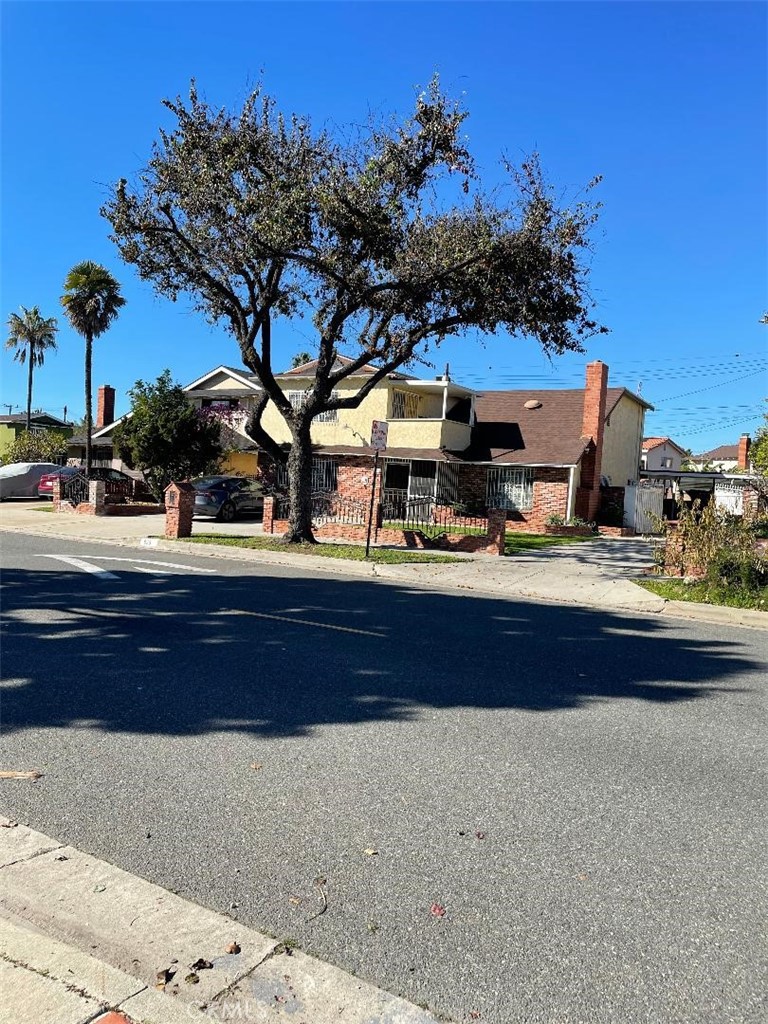a view of house with outdoor space and sitting area