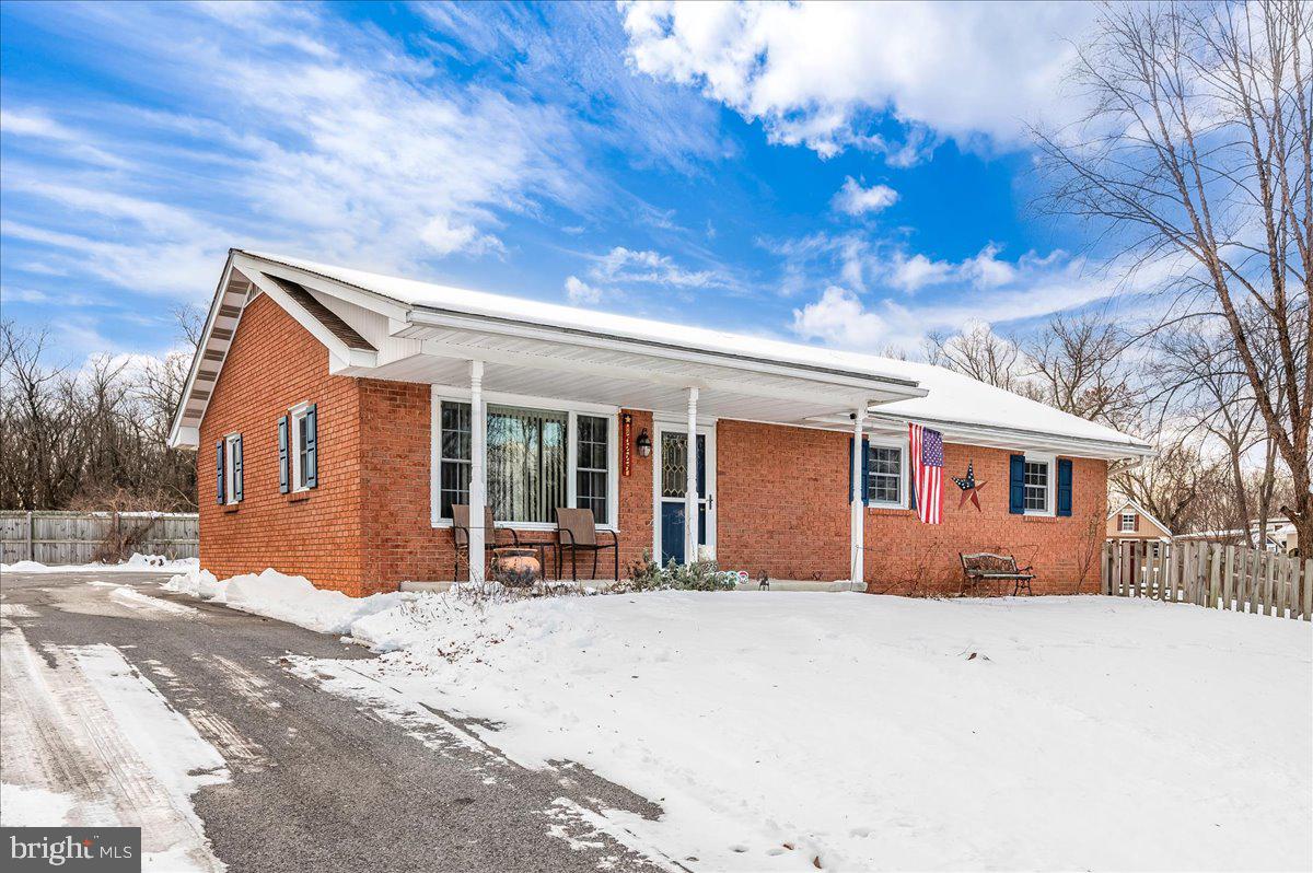 15225 Clear Spring Road Williamsport, MD 21795 - Photo 1 of 44 a front view of a house with a patio