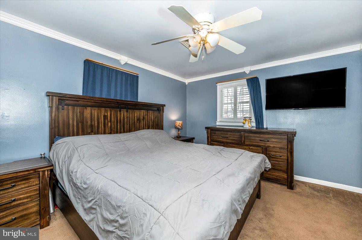15225 Clear Spring Road Williamsport, MD 21795 - Photo 15 of 44 a bedroom with a bed and a flat screen tv