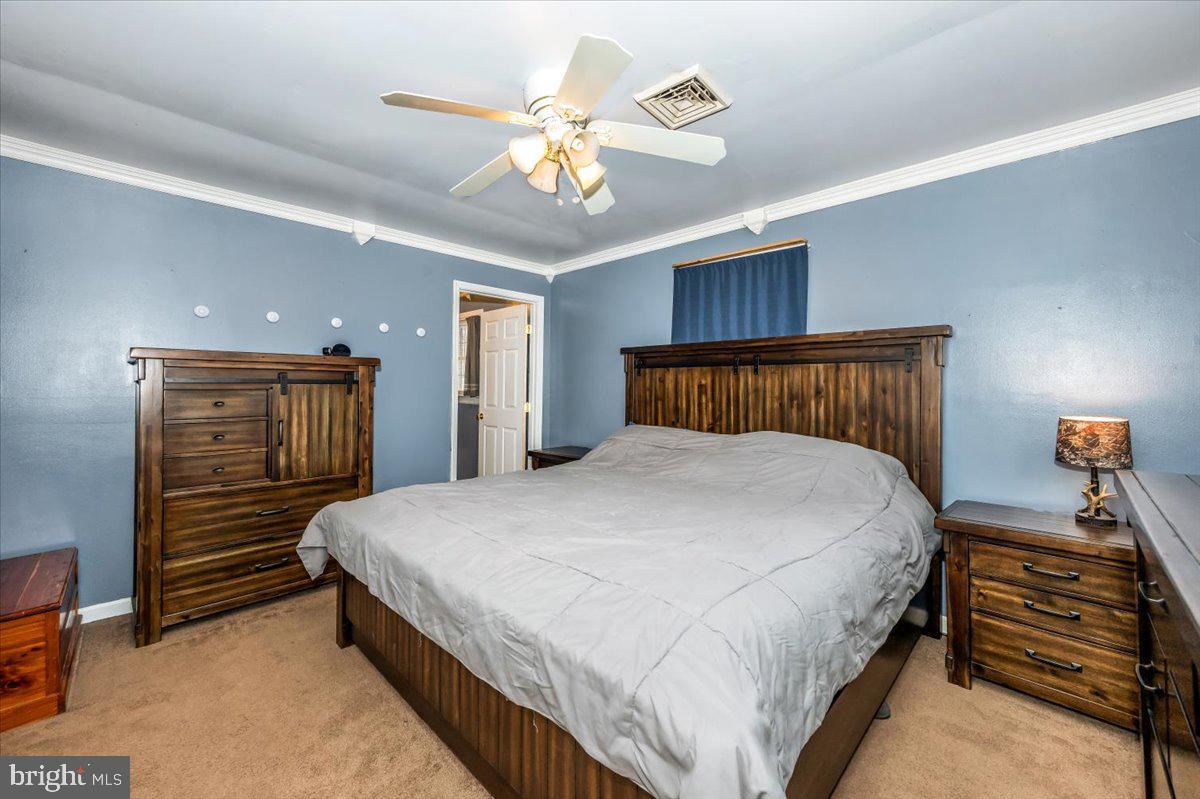 15225 Clear Spring Road Williamsport, MD 21795 - Photo 16 of 44 a bedroom with bed and wooden floor