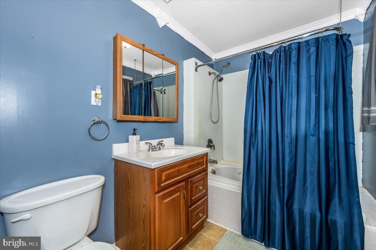 15225 Clear Spring Road Williamsport, MD 21795 - Photo 18 of 44 a bathroom with a toilet sink vanity and mirror