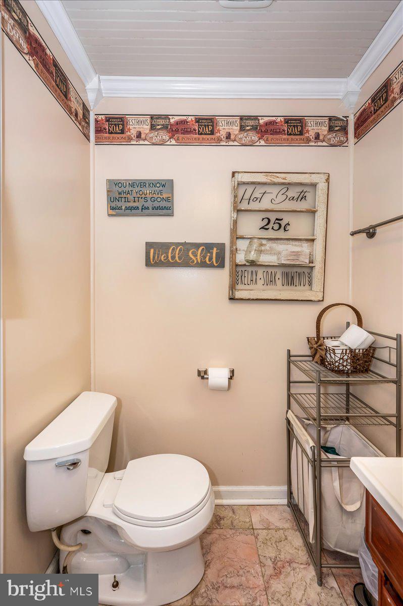 15225 Clear Spring Road Williamsport, MD 21795 - Photo 24 of 44 a bathroom with a toilet a sink and a shower