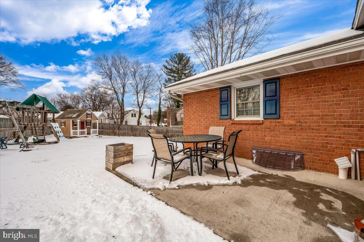 15225 Clear Spring Road Williamsport, MD 21795 - Photo 38 of 44 a view of a patio with a table and chairs