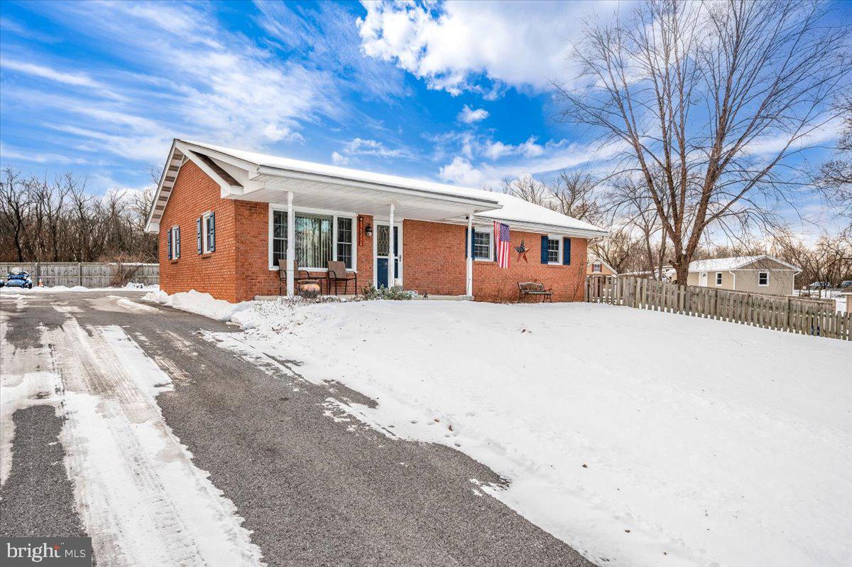 15225 Clear Spring Road Williamsport, MD 21795 - Photo 44 of 44 a front view of a house with a yard covered in snow