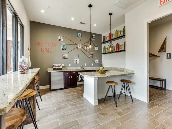 a kitchen with a table and chairs in it