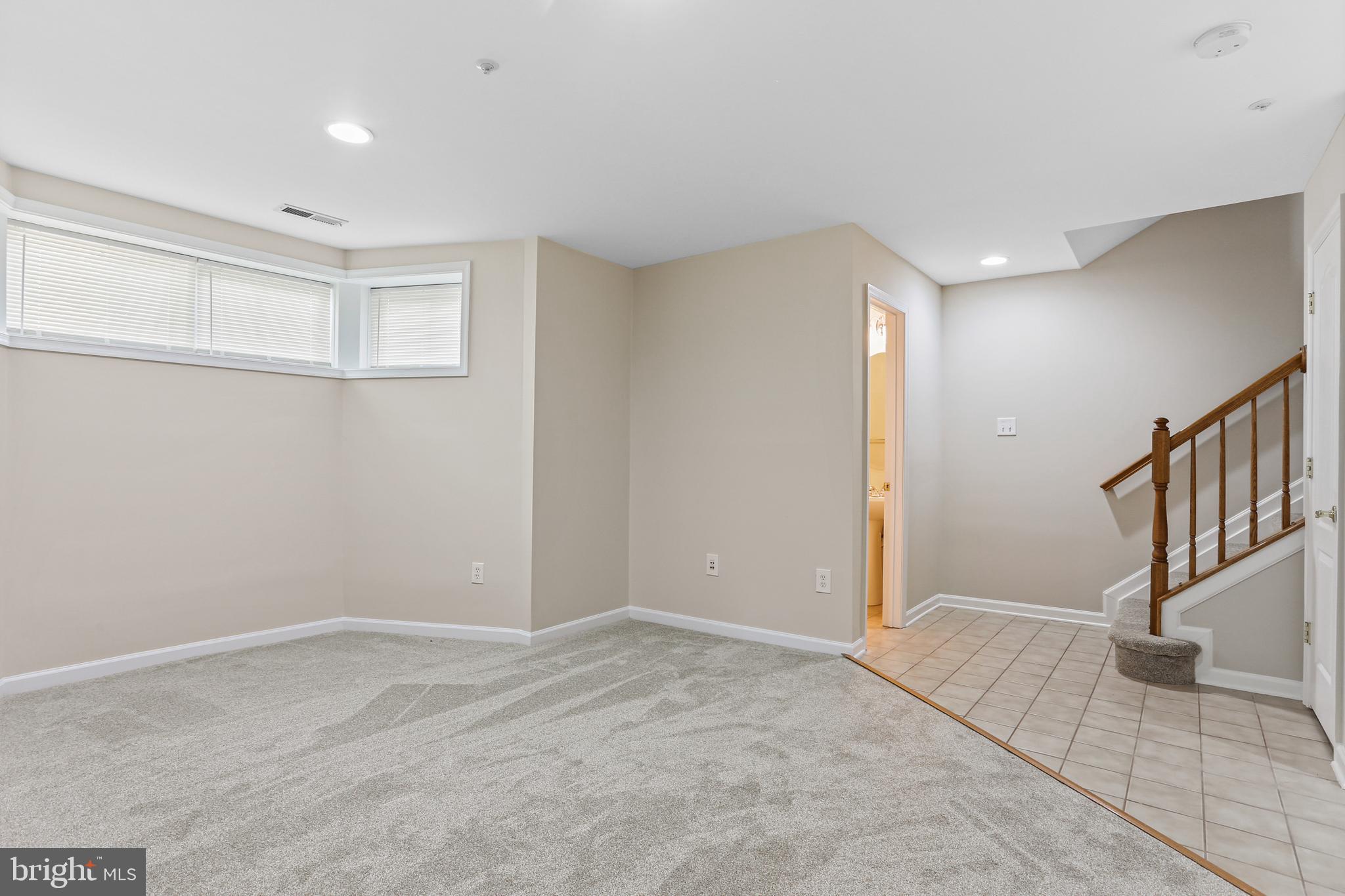 10232 Rutland Round Road, Unit 24 Columbia, MD 21044 - Photo 26 of 31 a view of an empty room with stairs