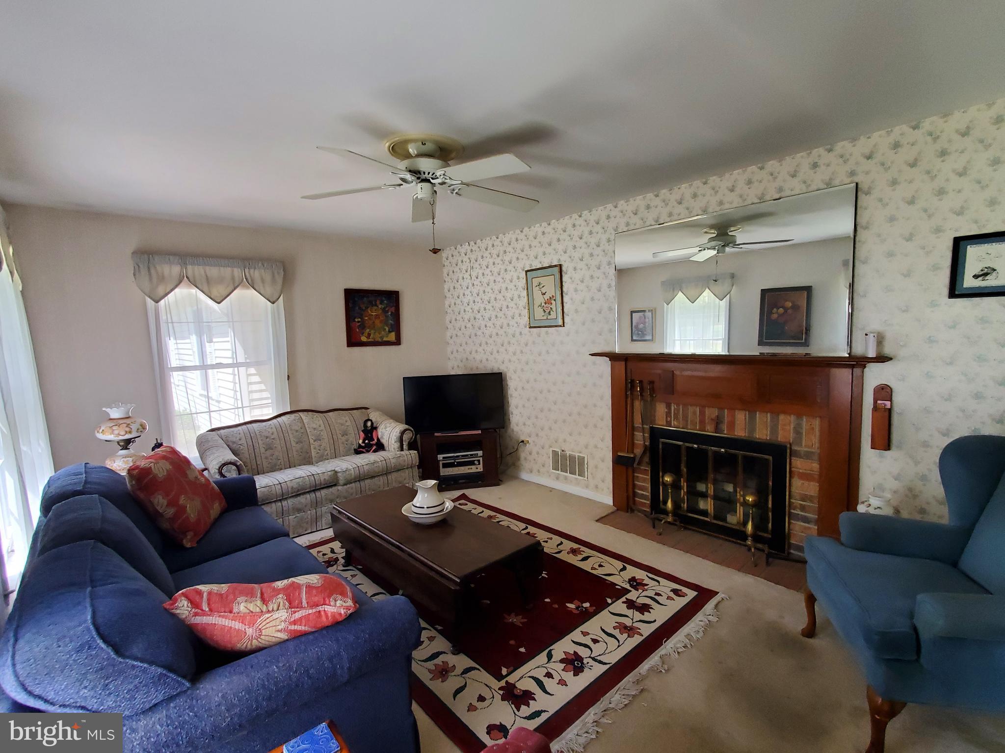 22075 Reynolds Pond Road Ellendale, DE 19941 - Photo 8 of 29 Living Room 2 (fireplace never used as-is)