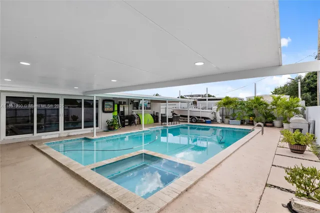 swimming pool with outdoor seating