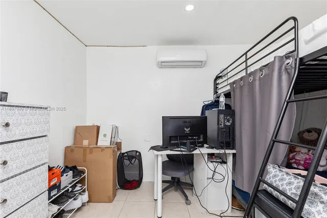 a view of walk in closet with clothes shoes washer and dryer