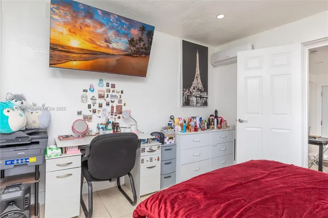 a bedroom with a bed and furniture