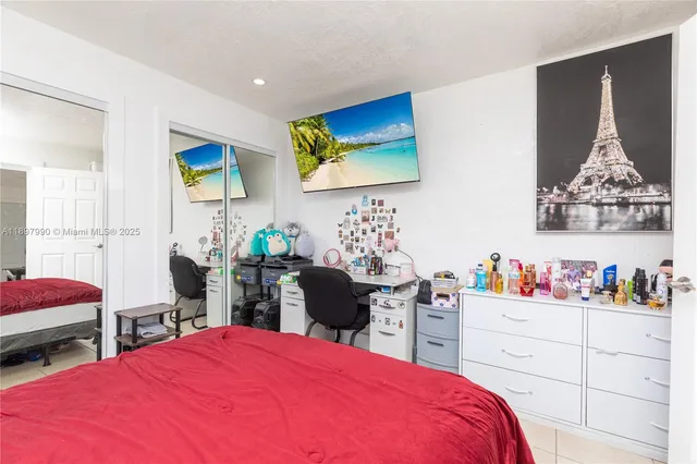 a bed room with a bed and dresser