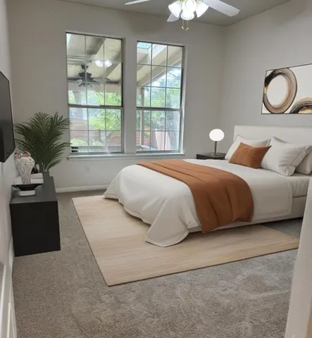 a bedroom with a large bed and a window