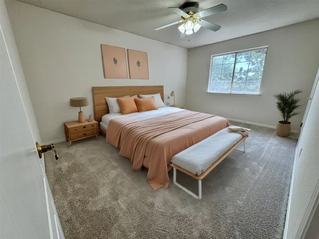 a bedroom with a bed and window