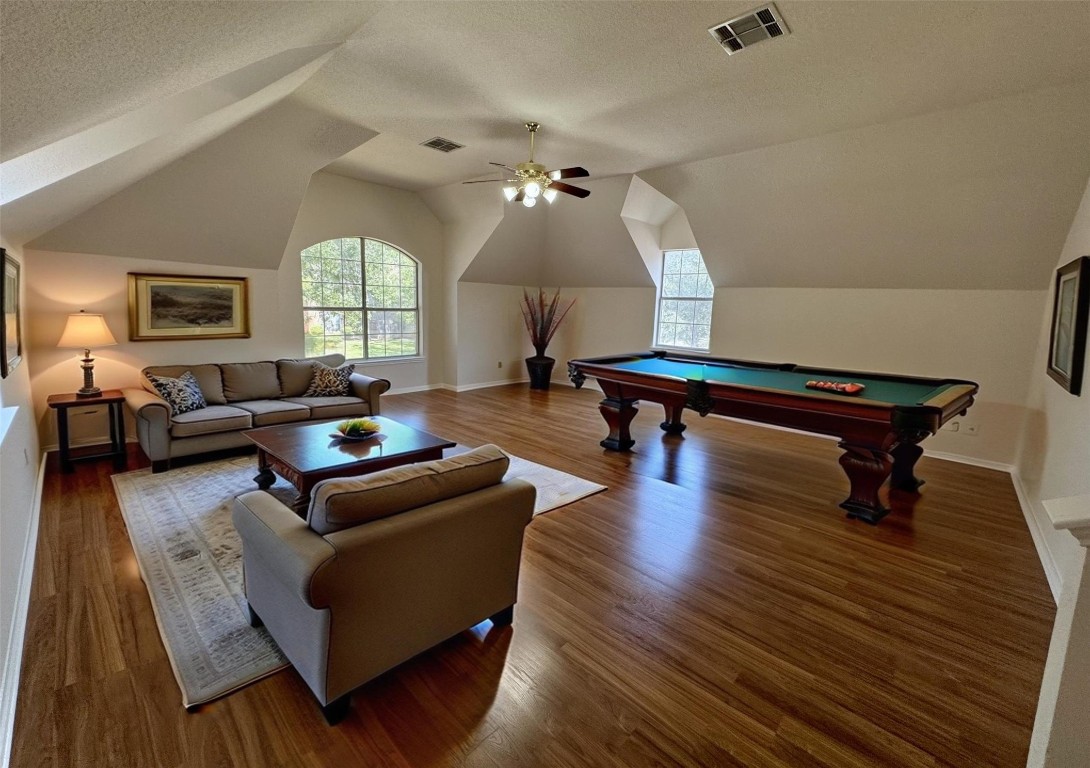 6319 Zadock Woods Drive Austin, TX 78749 - Photo 32 of 39 a living room with furniture and a wooden floor