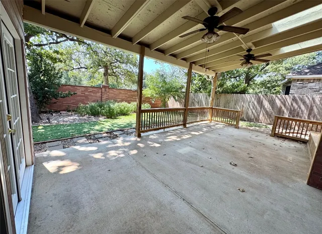 a view of a room with wooden floor and roof