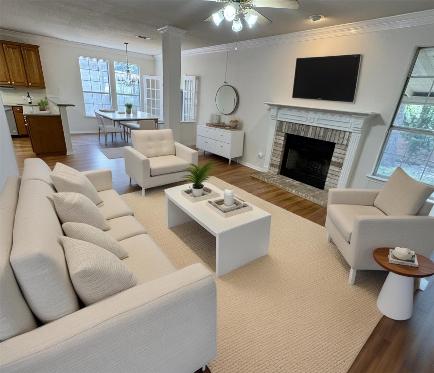 6319 Zadock Woods Drive Austin, TX 78749 - Photo 9 of 39 a living room with furniture a flat screen tv and a fireplace