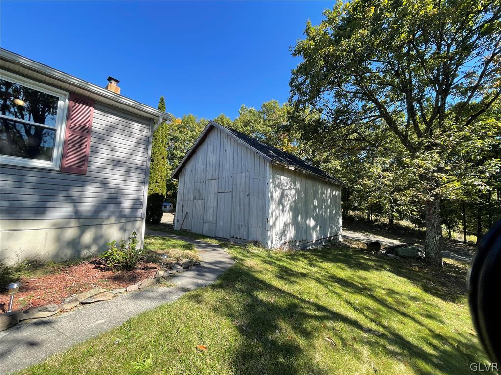 147 Tilly Lane Effort, PA 18330 - Photo 11 of 48 a view of backyard with large tree and wooden fence