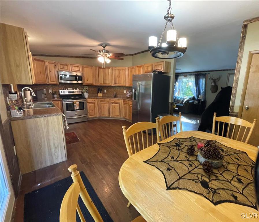 147 Tilly Lane Effort, PA 18330 - Photo 15 of 48 a bedroom with furniture a chandelier and wooden floor