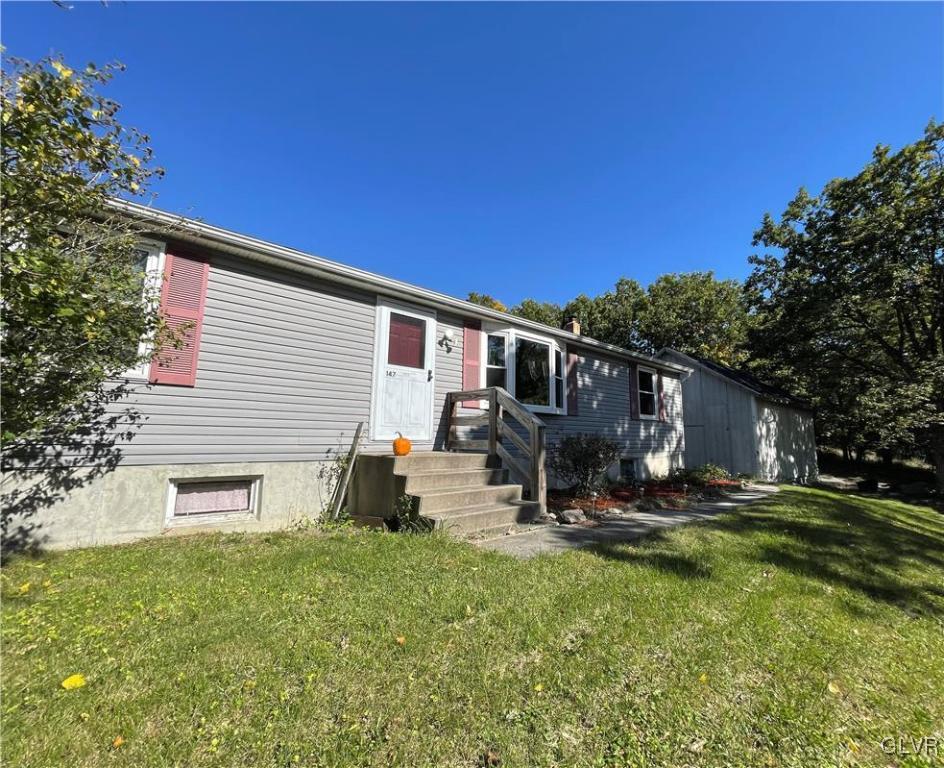 147 Tilly Lane Effort, PA 18330 - Photo 2 of 48 a backyard of a house with table and chairs