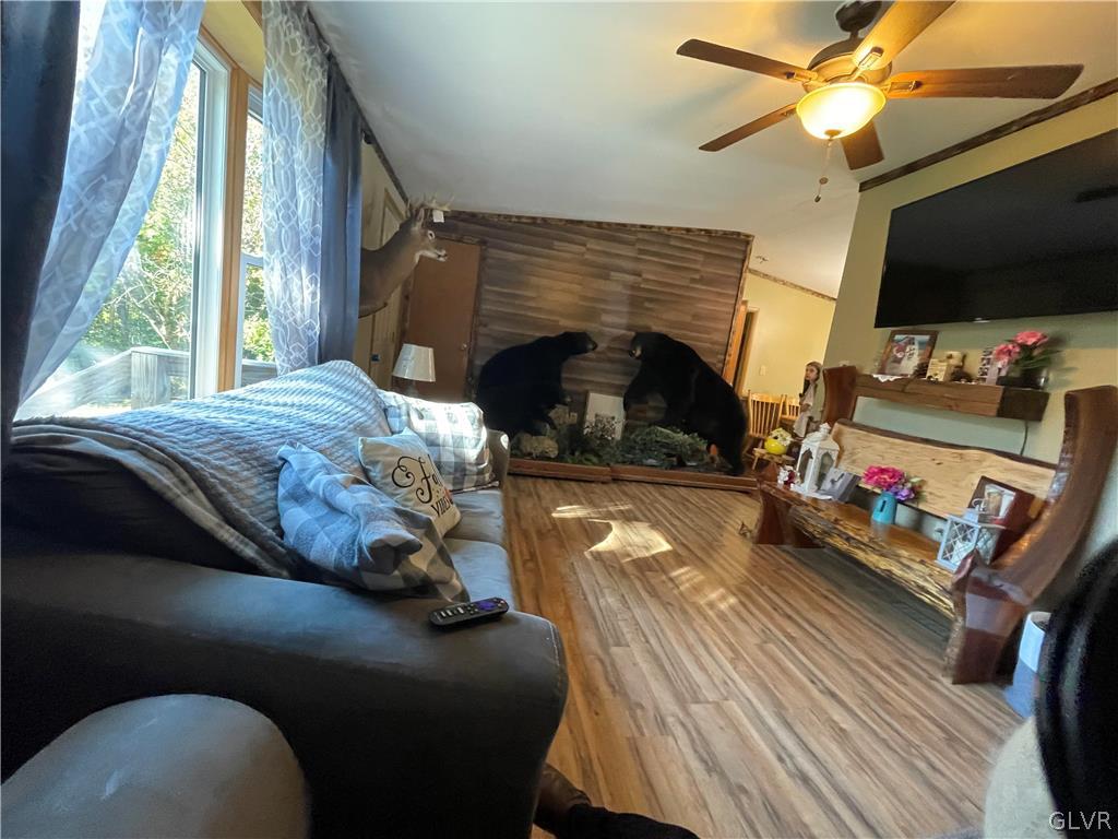 147 Tilly Lane Effort, PA 18330 - Photo 25 of 48 a bedroom with a bed and a flat screen tv