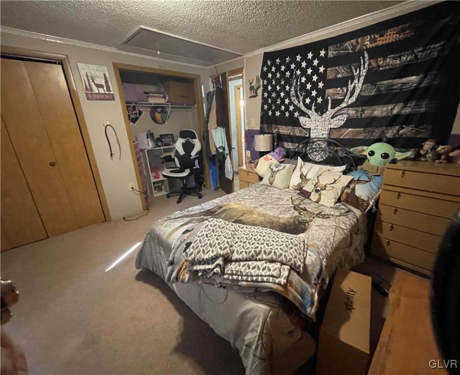 147 Tilly Lane Effort, PA 18330 - Photo 26 of 48 a bedroom with a bed with wooden floor