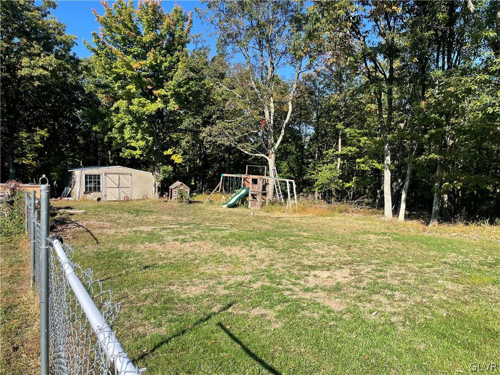 147 Tilly Lane Effort, PA 18330 - Photo 3 of 48 a view of a field with trees in the background