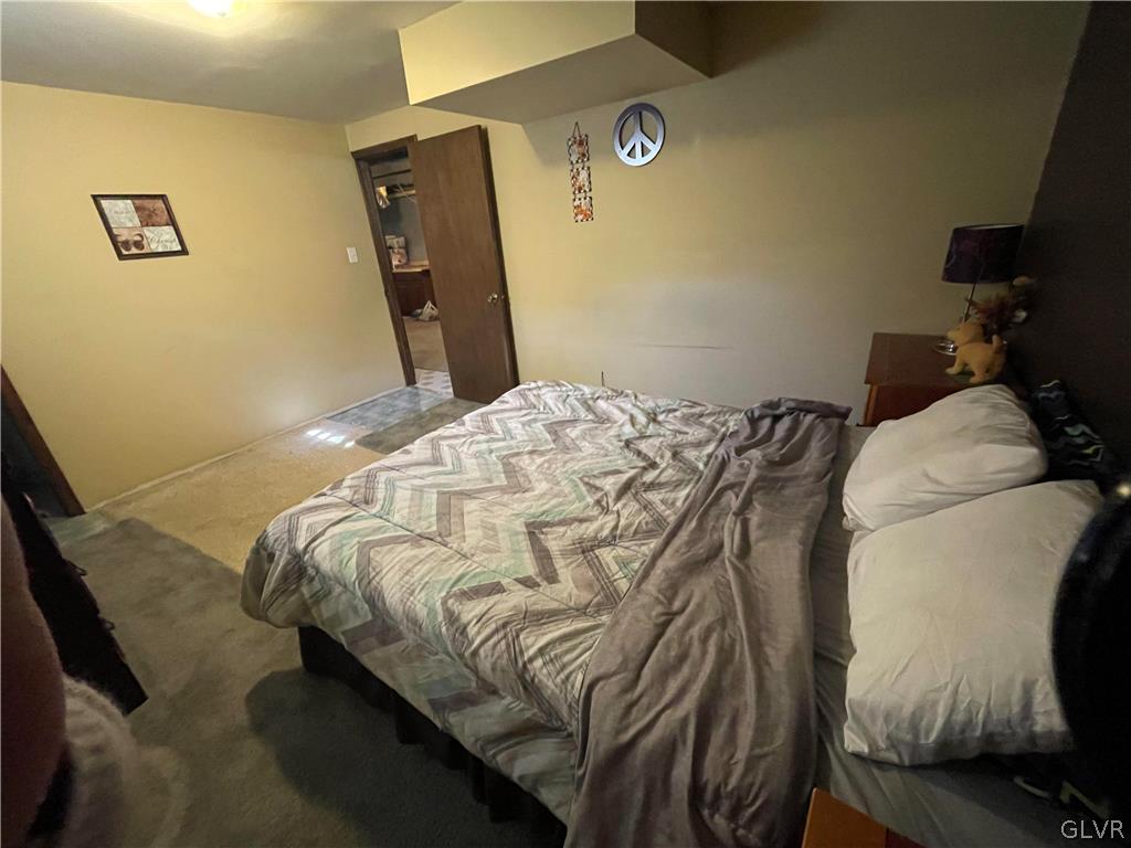 147 Tilly Lane Effort, PA 18330 - Photo 38 of 48 a bed sitting in a bedroom next to a window