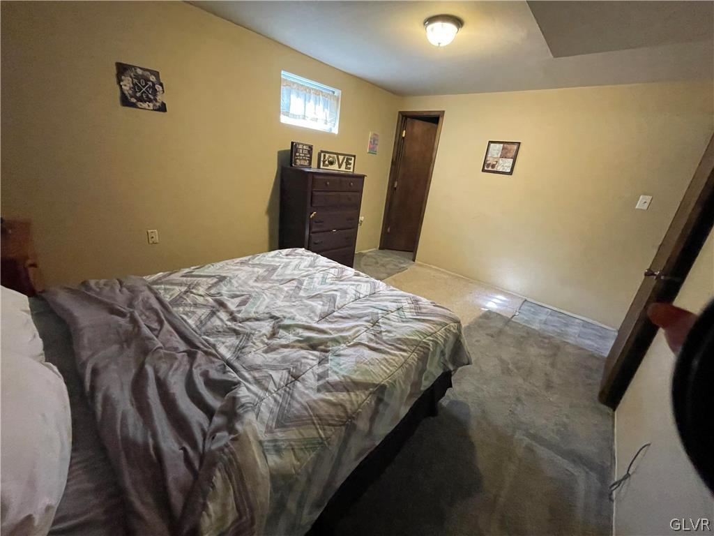 147 Tilly Lane Effort, PA 18330 - Photo 39 of 48 a bed sitting in a bedroom next to a window