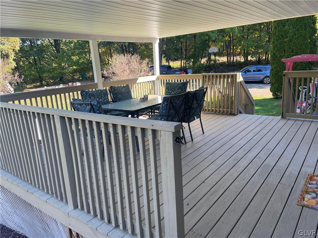 147 Tilly Lane Effort, PA 18330 - Photo 7 of 48 a view of balcony with furniture and wooden deck