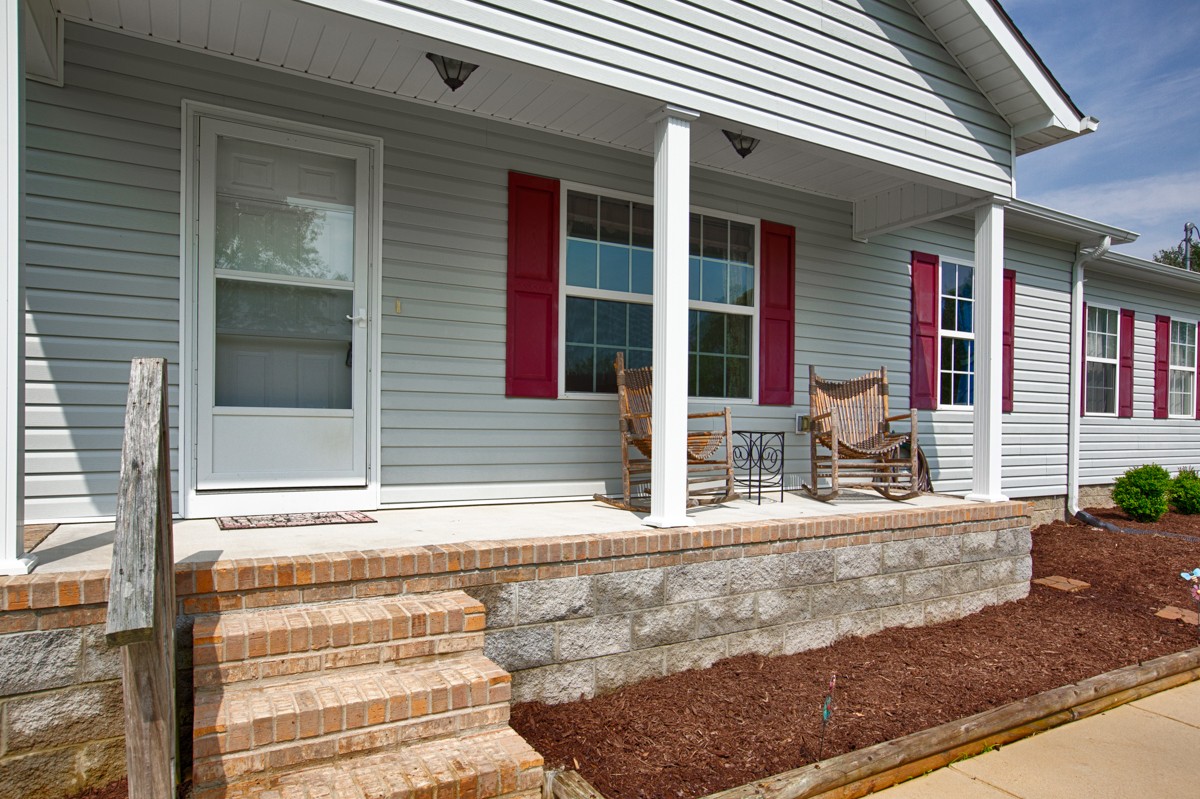 253 Old Baptist Road Ardmore, TN 38449 - Photo 3 of 23 front view of a house with a porch