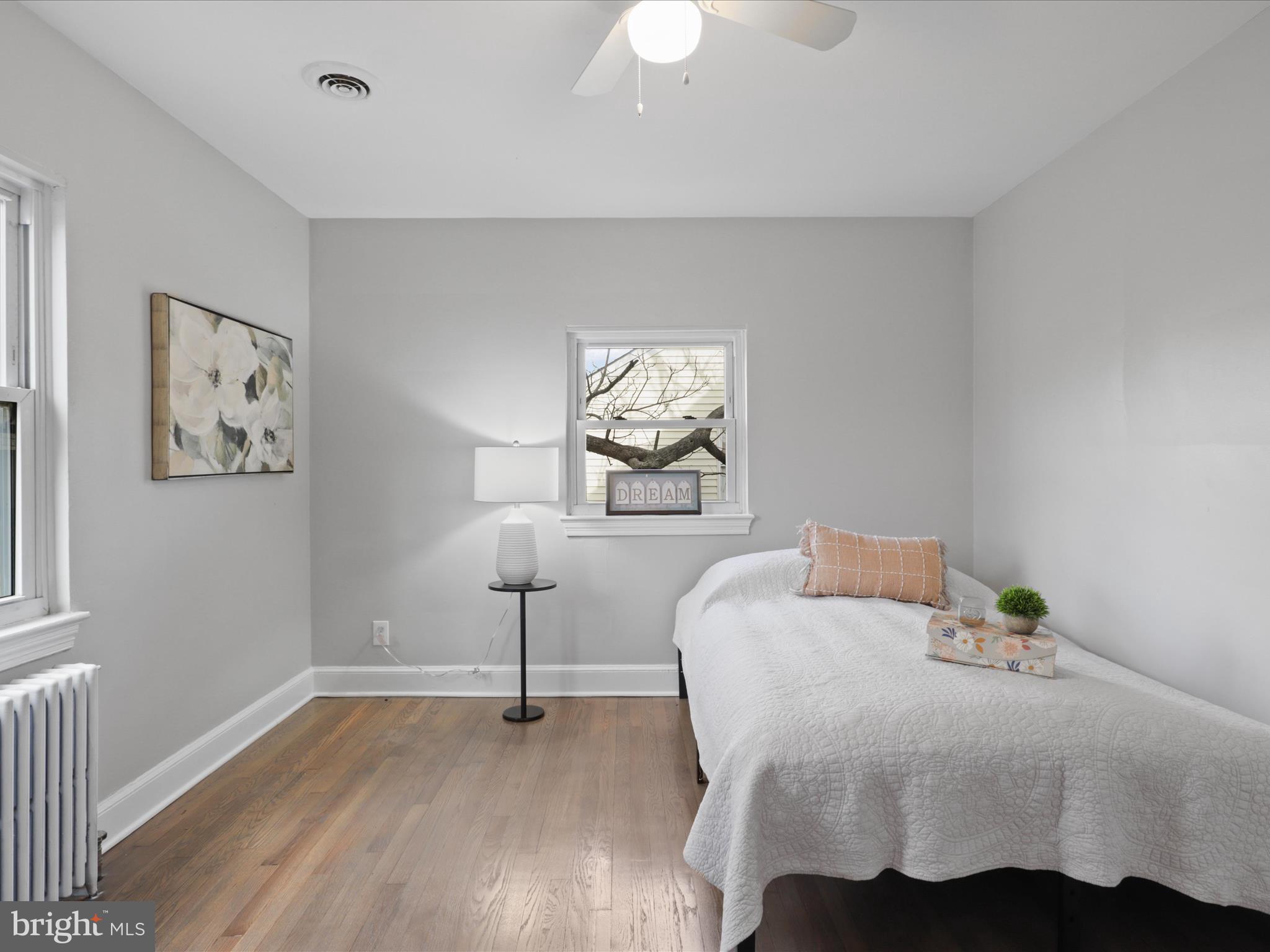2608 Arlington Boulevard, Unit AP 2 Arlington, VA 22204 - Photo 1 of 14 a bedroom with a bed and a chandelier