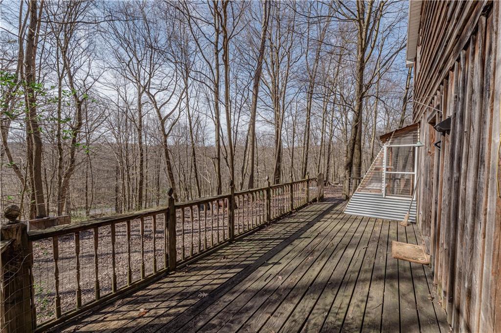 185 Turk Road Slippery Rock, PA 16057 - Photo 5 of 24 a view of a balcony with wooden floor and fence