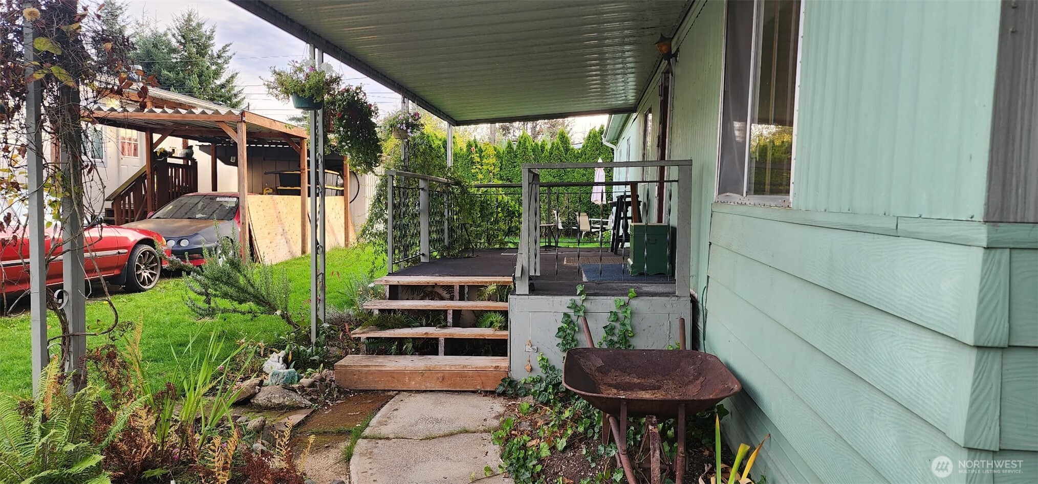 8403 Northeast St Johns Road, Unit 6 Vancouver, WA 98665 - Photo 2 of 9 a view of a chairs and table in backyard