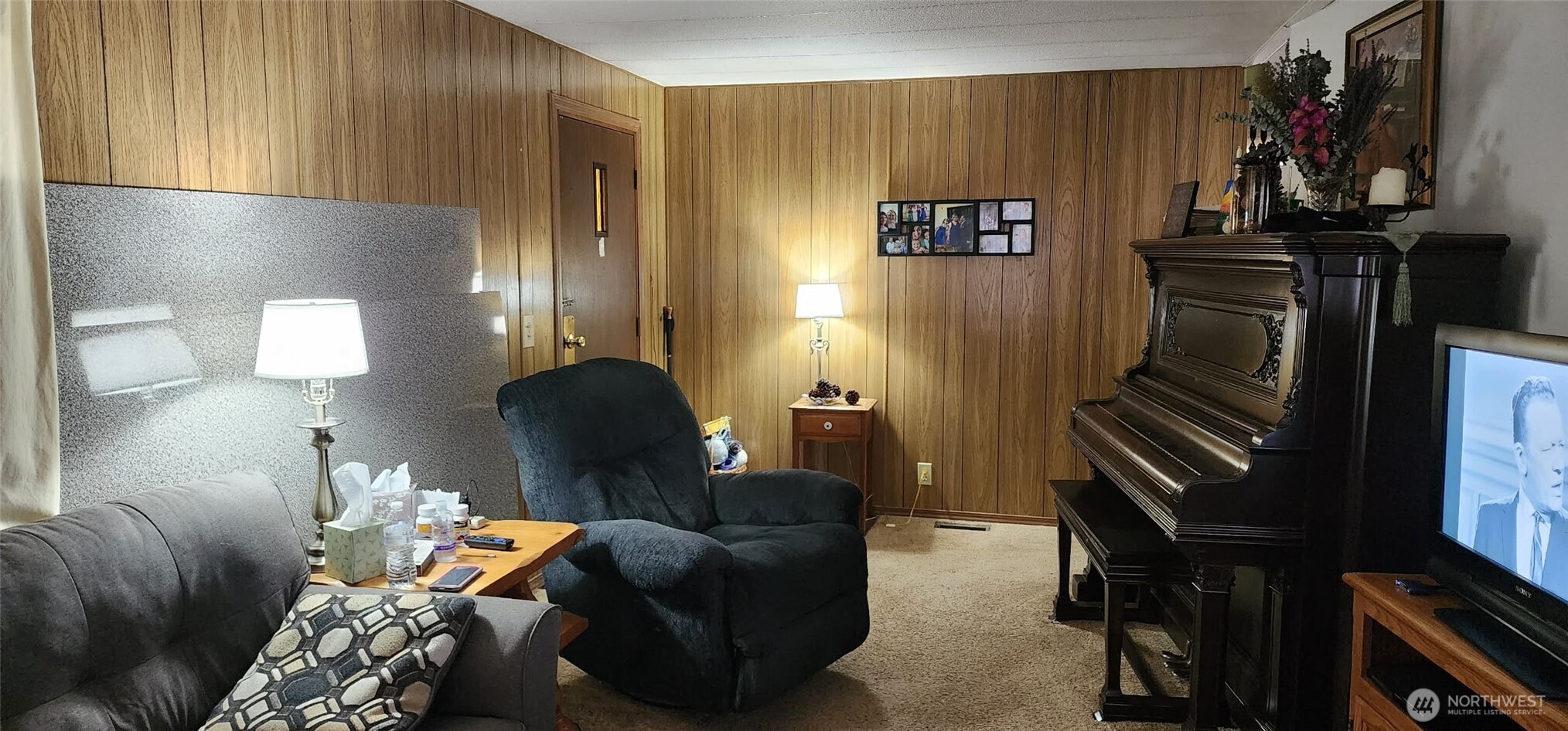 8403 Northeast St Johns Road, Unit 6 Vancouver, WA 98665 - Photo 4 of 9 a living room with furniture and a fireplace