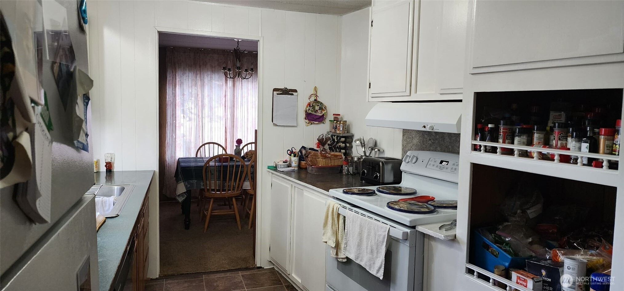 8403 Northeast St Johns Road, Unit 6 Vancouver, WA 98665 - Photo 7 of 9 a kitchen with stainless steel appliances a stove a sink a microwave and cabinets