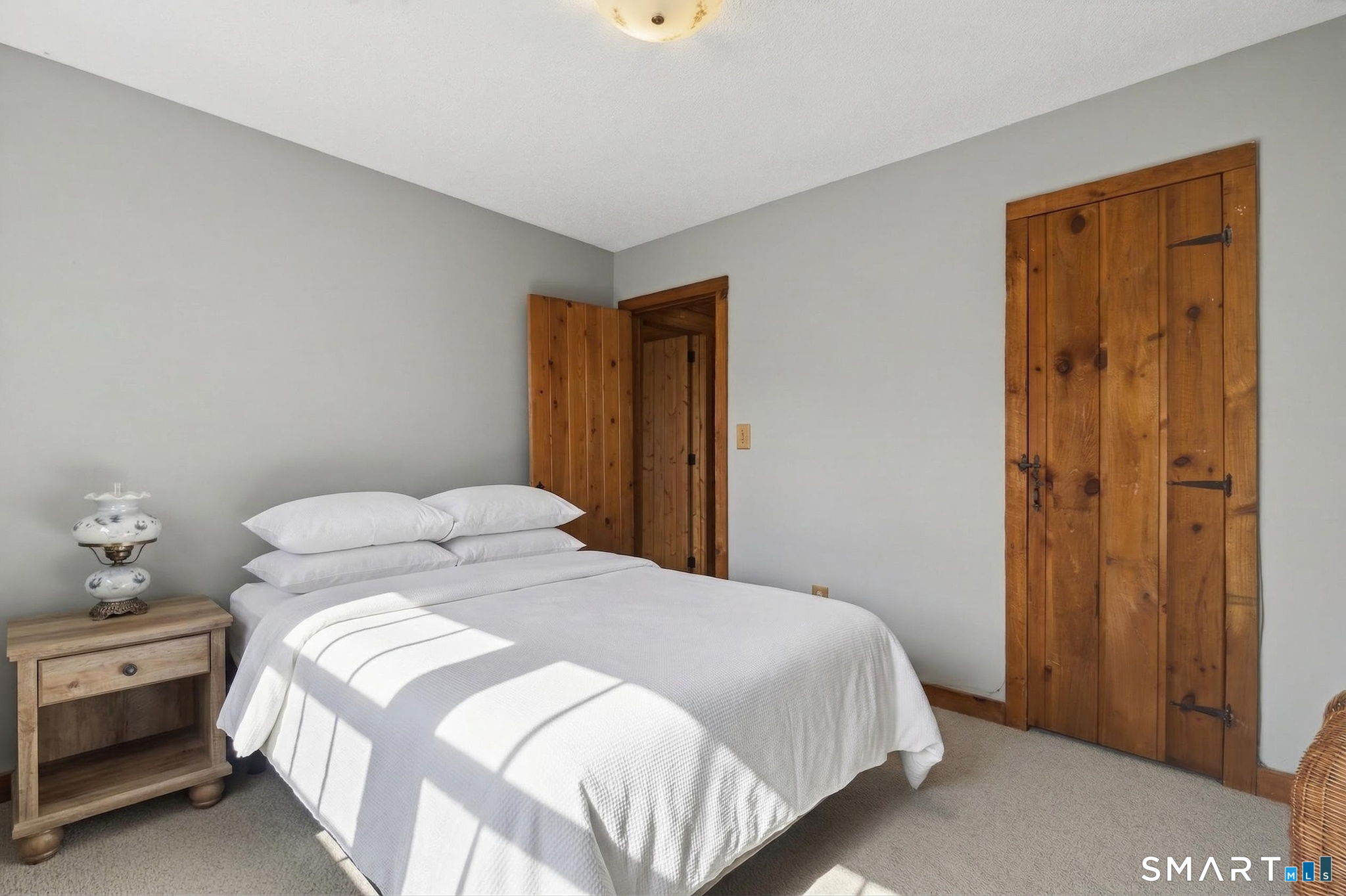 737 Shepard Avenue Hamden, CT 06514 - Photo 21 of 33 a bedroom with a bed and a table