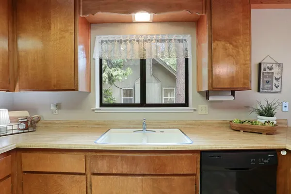 a sink sitting next to a window