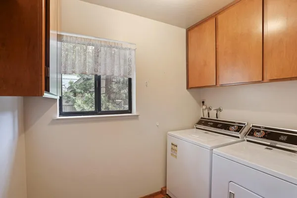 a view of storage and utility room with washer and dryer